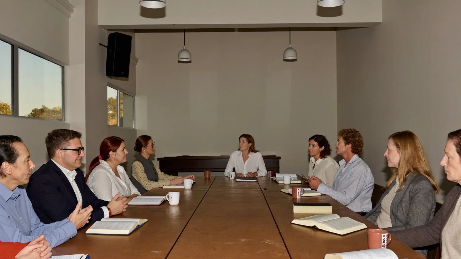 Church leaders meeting around the board table at Edmonton Central