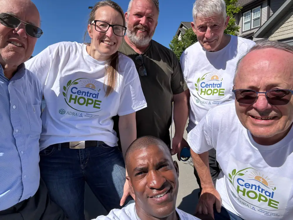 Church members in Central Hope volunteer shirts before going out into the neighbourhood